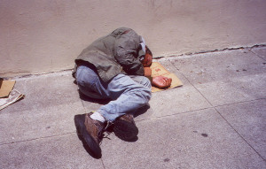 Homeless-person-lying-in-street
